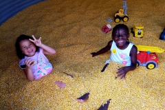 children-in-corn-bin